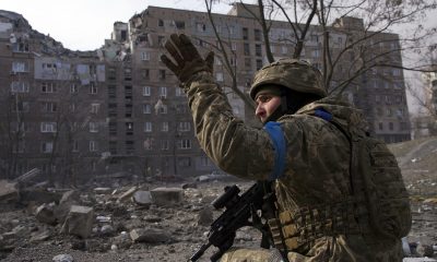 A Ukrainian serviceman guards his position in Mariupol, Ukraine, Saturday, March 12, 2022. (AP Photo/Mstyslav Chernov)